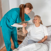 caretaker assisting senior woman